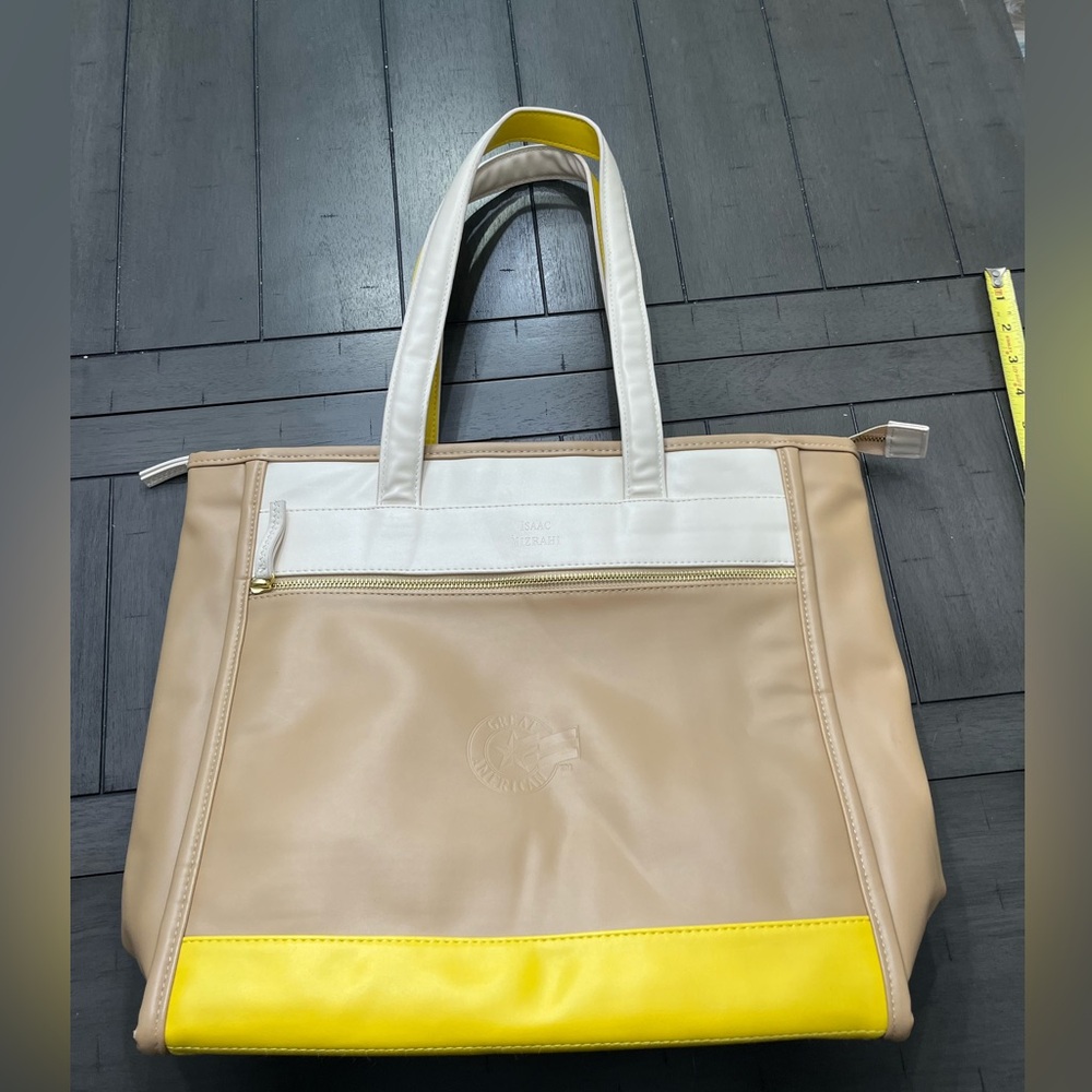 Isaac Mizrah large office bag. Has a laptop zip up soft cover as well.